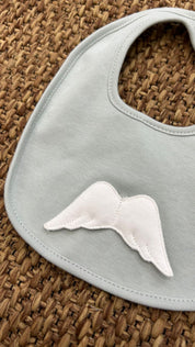 Bavetta neonato con ricamo ali chiusura strappo Baby Gi