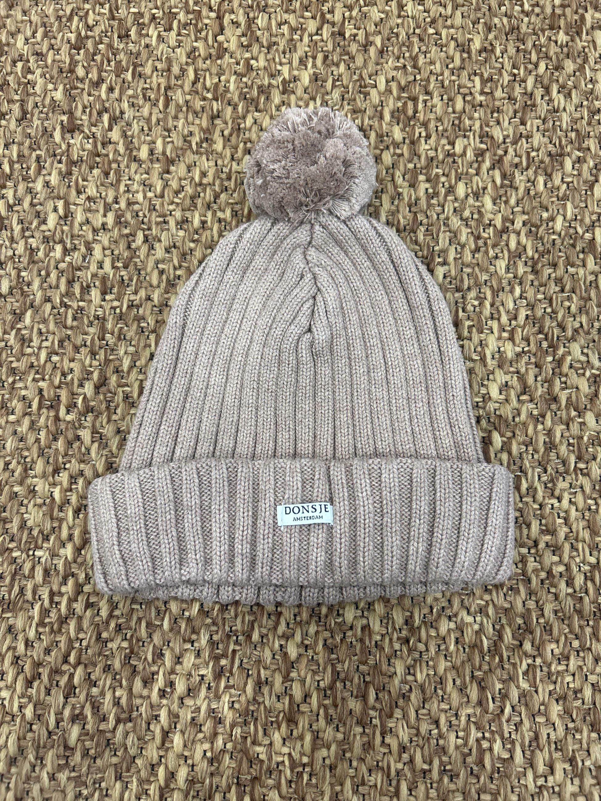 Cappellino di lana pon pon Donsje